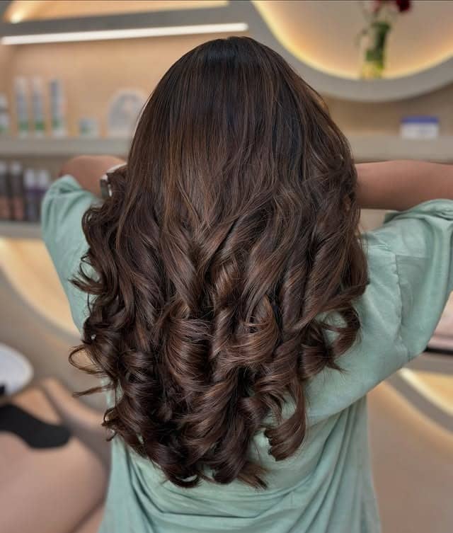 13. Espresso Swirl Voluminous Curls - Espresso Hair Color
