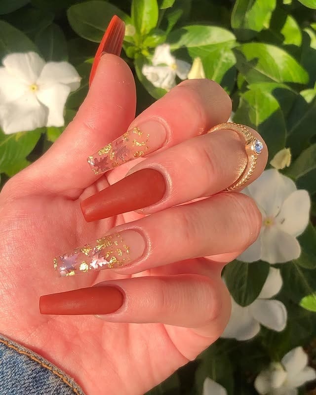 16. Burnt Terracotta Coffin Nails with Gold Foil Accents - fall coffin nail ideas