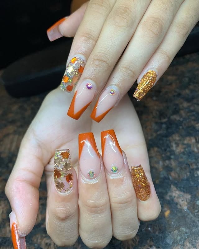 17. Maple Glow Coffin Nails with Glitter and Leaf Accents - fall coffin nail ideas