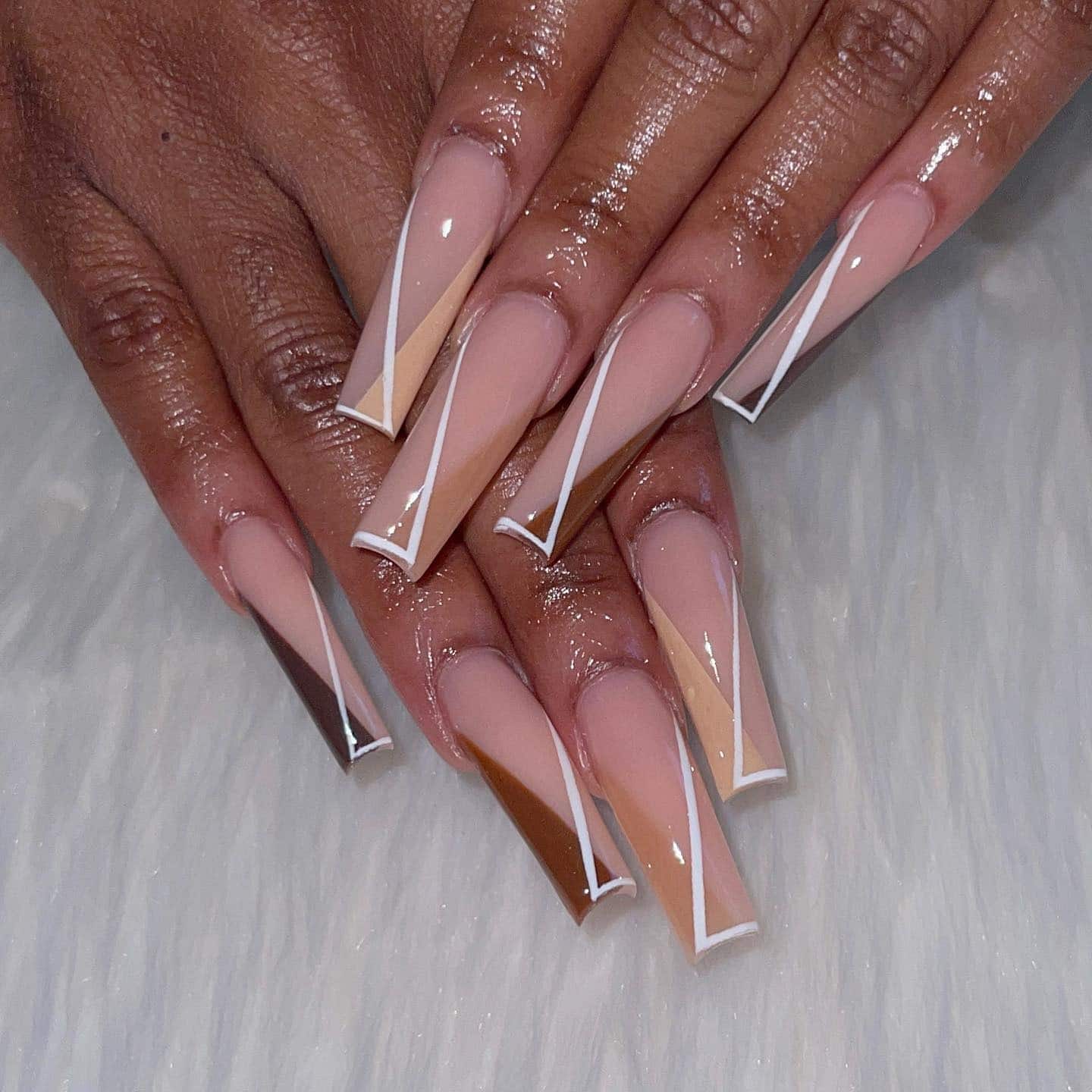 21. Geometric Caramel Coffin Nails with Crisp White Lines - fall coffin nail ideas