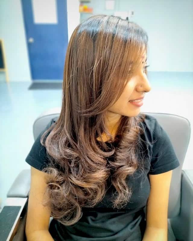 11. Soft Layered Fringe with Caramel Highlights – Glossy Brunette Elegance - Fringe Hairstyles