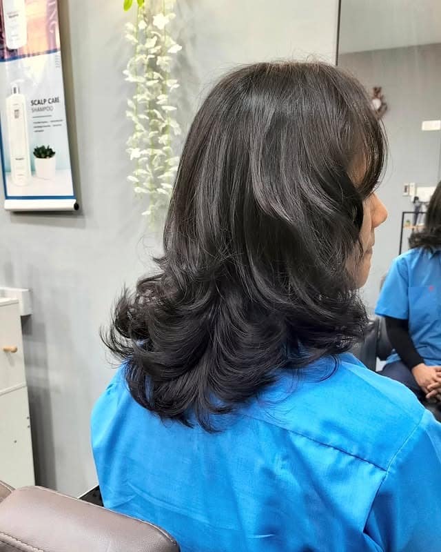 15. Feathered Layers with Side Fringe – Midnight Black Shine - Fringe Hairstyles