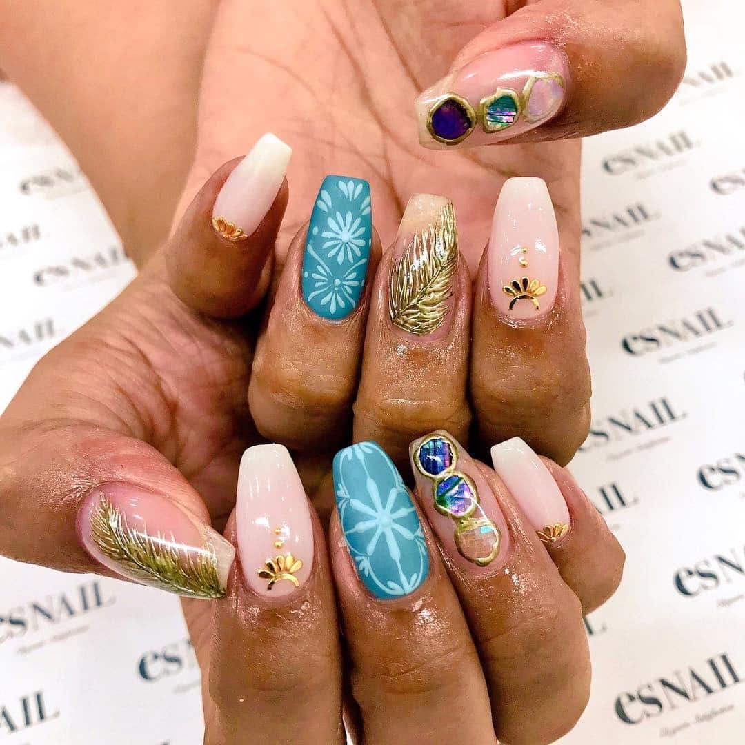 1. Ocean Breeze Feather Nails - feather nail ideas