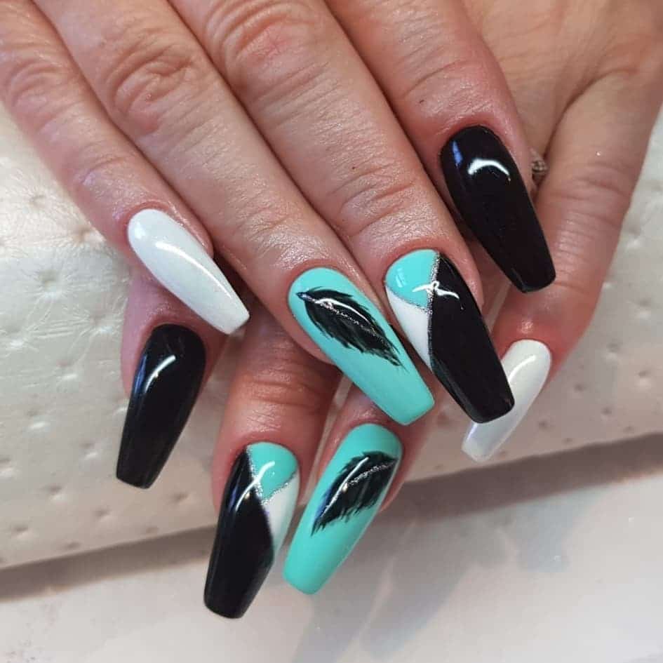 4. Aqua Noir Feather Fusion - feather nail ideas