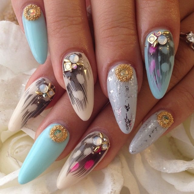 14. Gilded Feather Fantasy Nails - feather nail ideas
