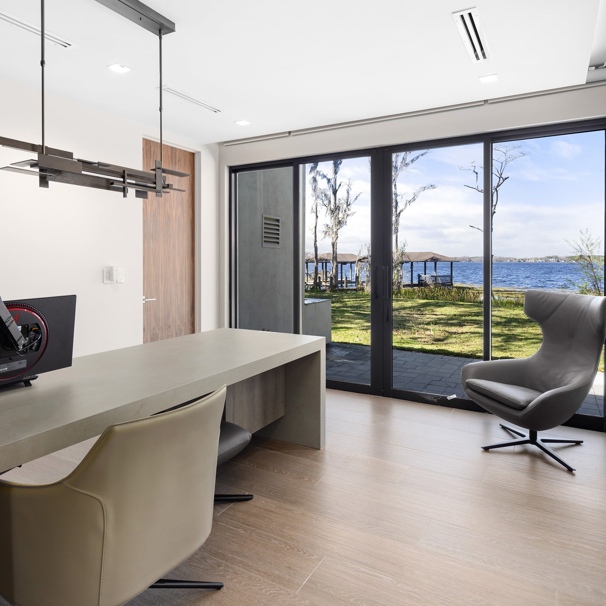 9. Sleek Lakeside Office with Natural Serenity - bright office ideas