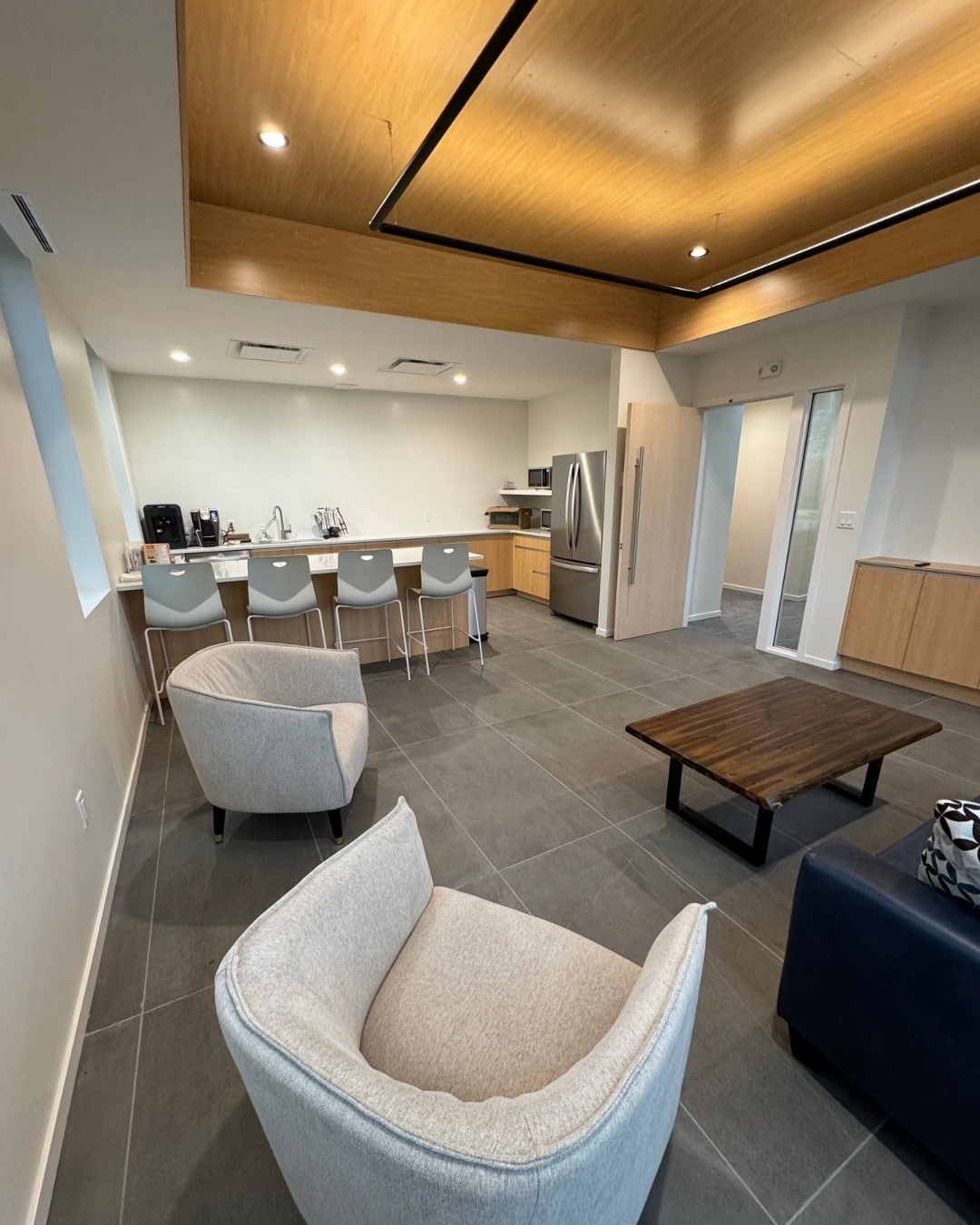 14. Contemporary Lounge Office with Wood Accents - bright office ideas