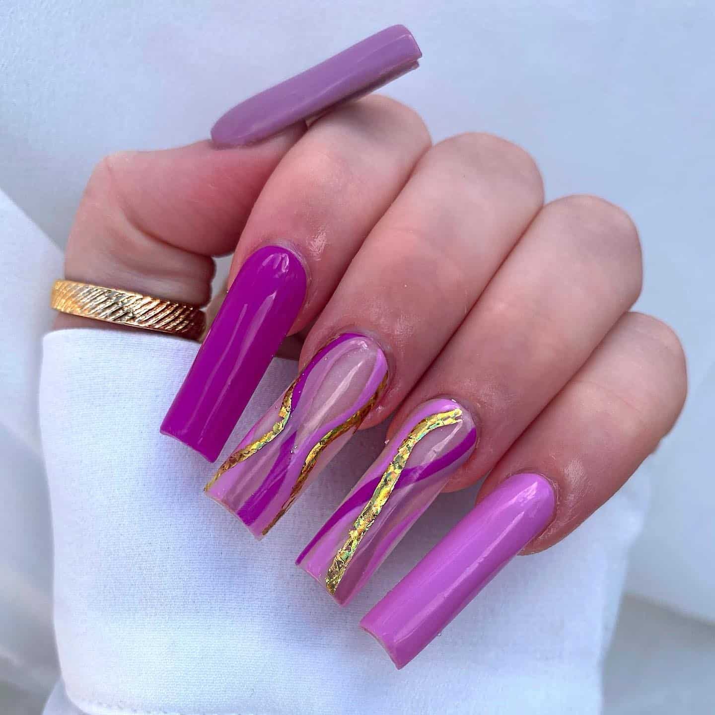 1. Regal Amethyst Flow with Gold Veins - gold and purple nail ideas