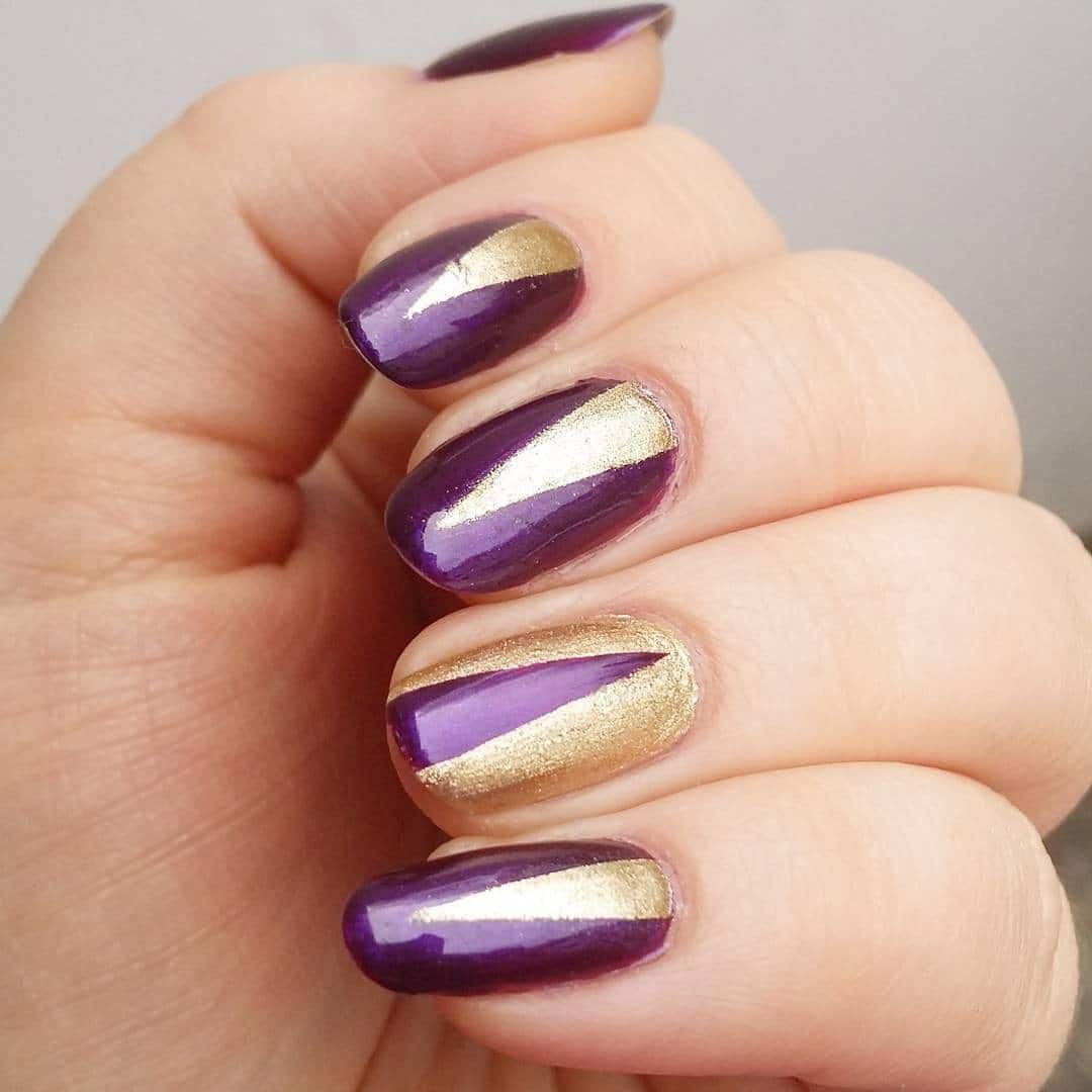 13. Diagonal Gold Beam on Amethyst Base - gold and purple nail ideas