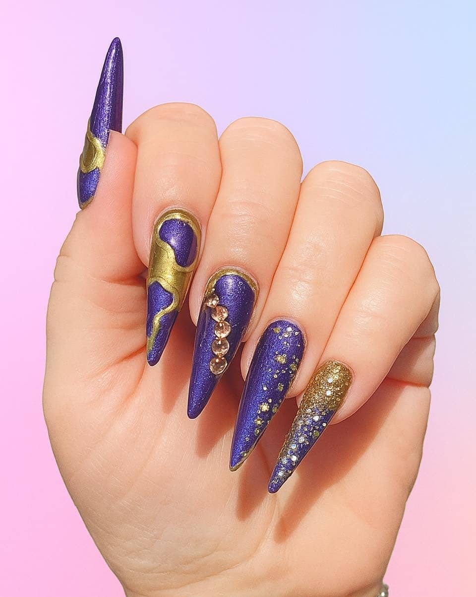 16. Celestial Luxe in Royal Gold and Purple - gold and purple nail ideas