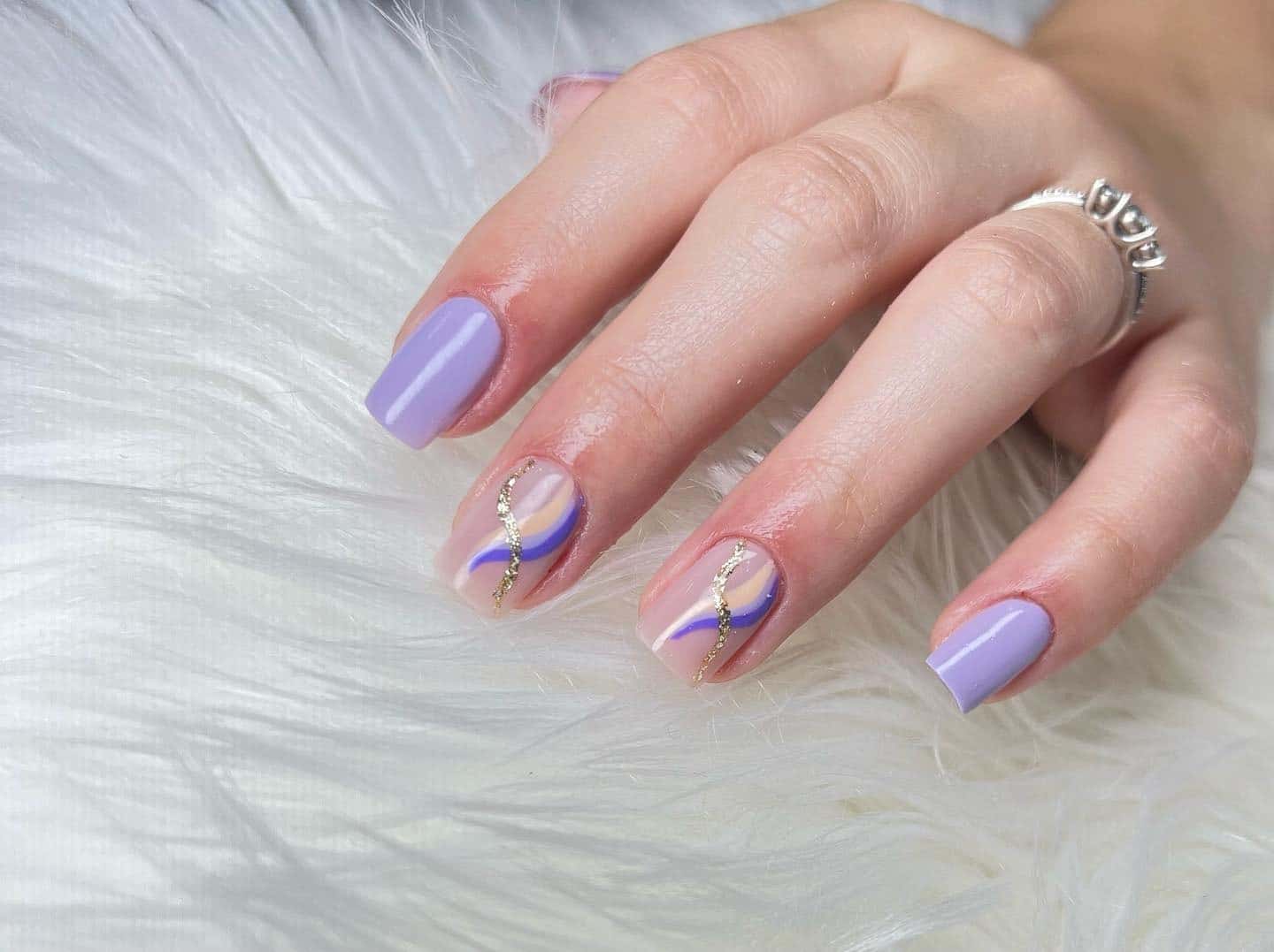 18. Soft Lilac Streamlined Elegance - gold and purple nail ideas