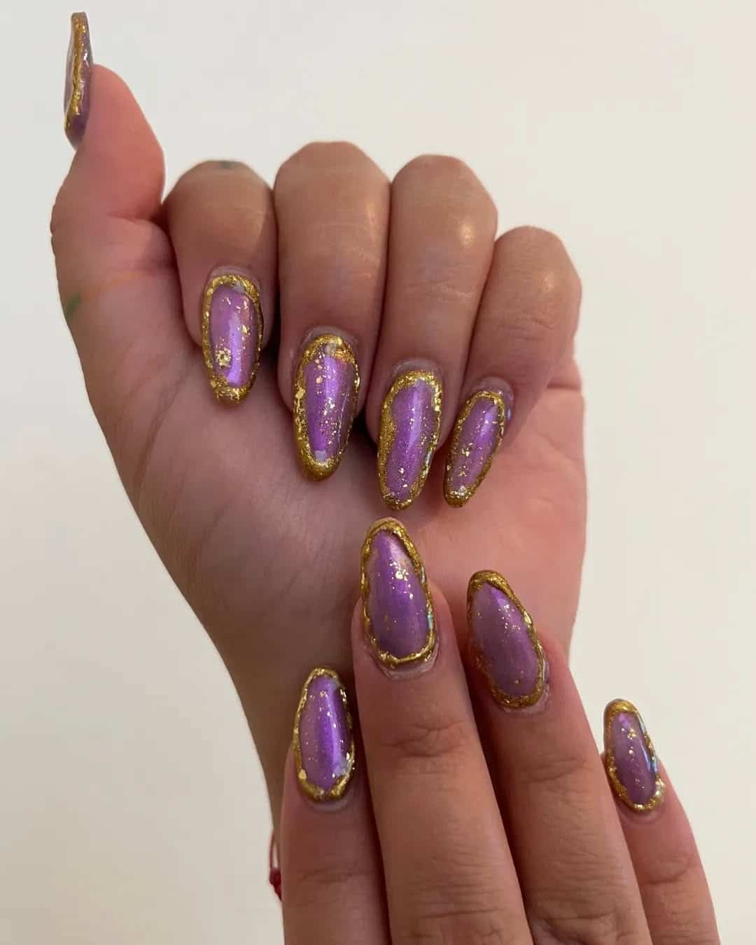 19. Iridescent Orchid Frame with Gilded Edge - gold and purple nail ideas