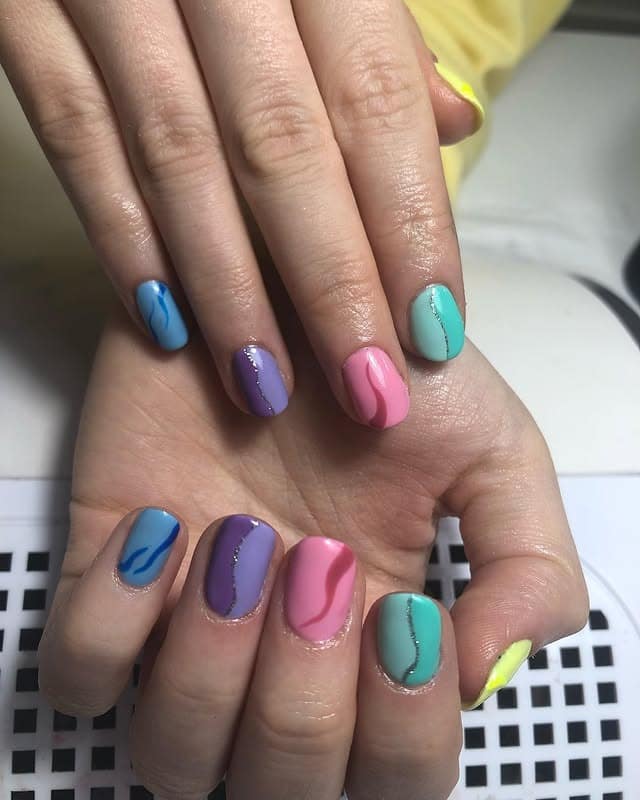 9. Pastel Split Spectrum - half nail ideas