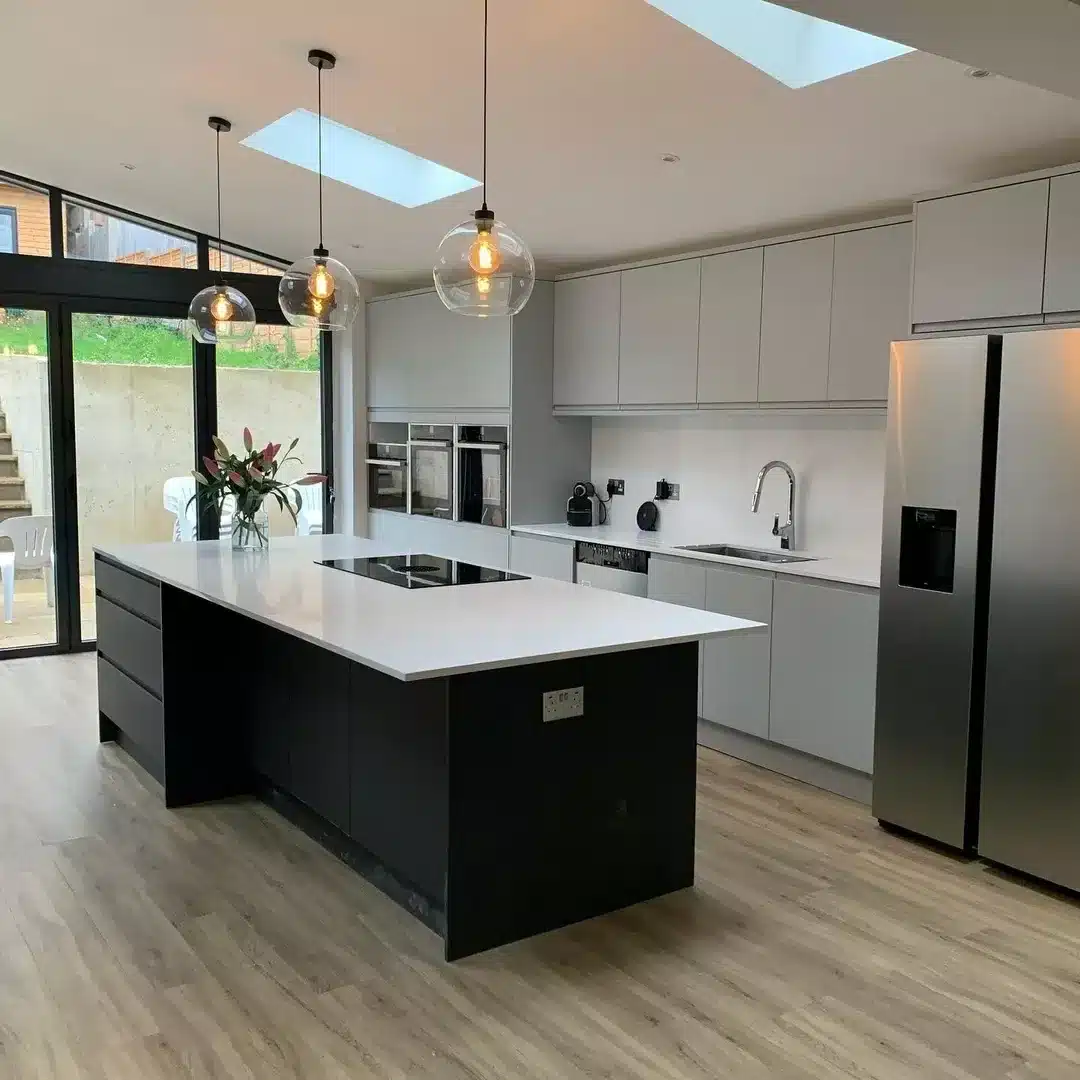 2. Minimalist Elegance with Black and Glass Accents - kitchen lighting ideas