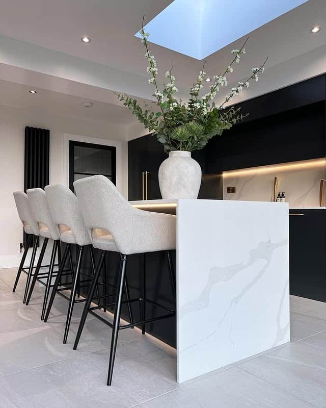 4. Contemporary Contrast with Monochrome Layers - kitchen lighting ideas