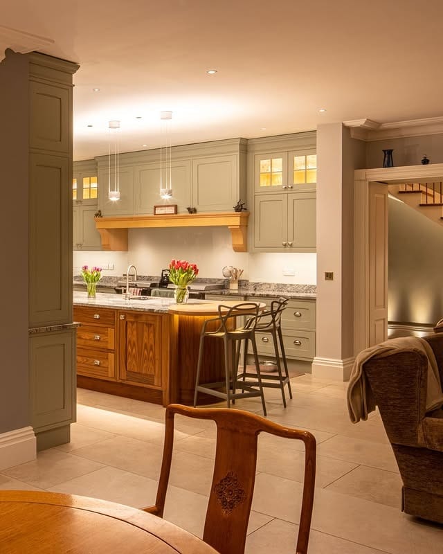 17. Classic Comfort in Green and Wood - kitchen lighting ideas