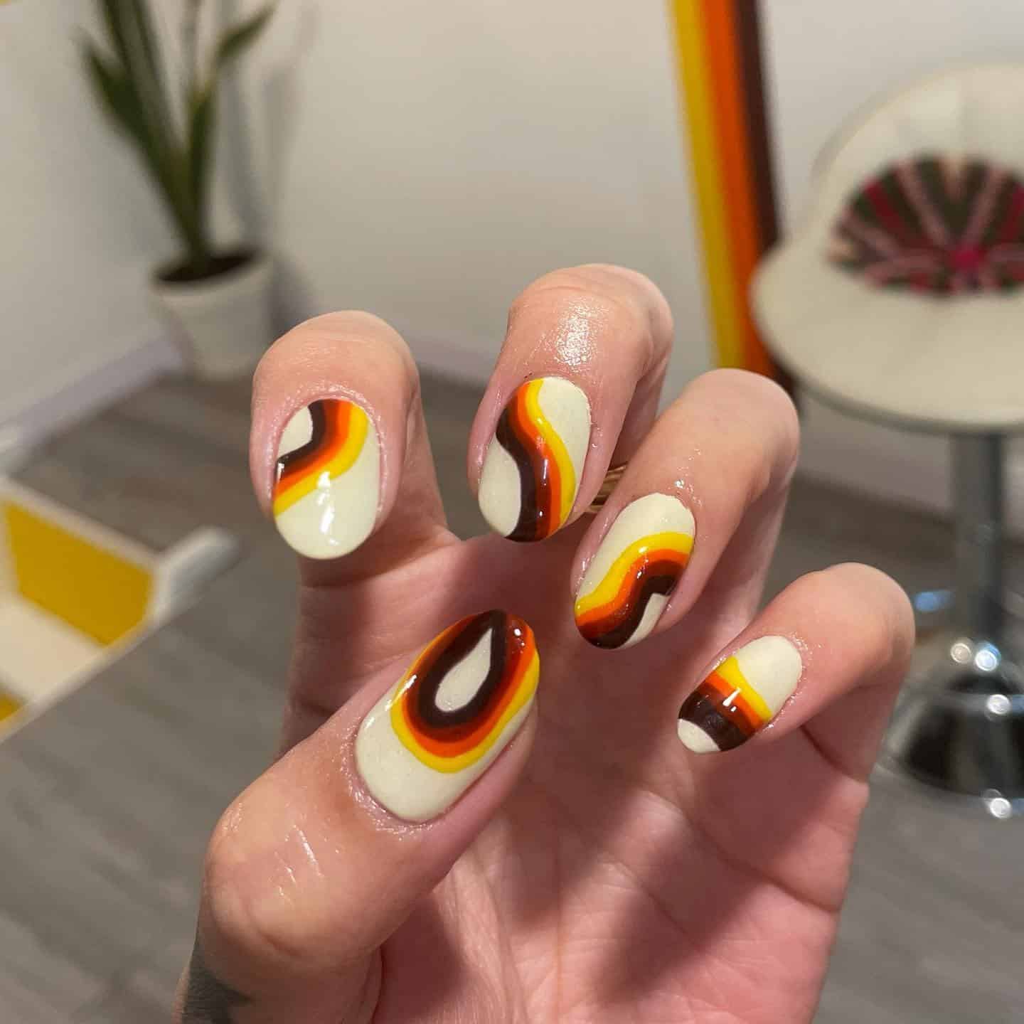 10. Vintage Sunset Swirl Nails - hippie nail ideas