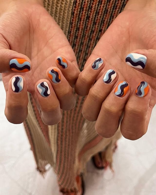 21. Groovy Waves Retro Nails - hippie nail ideas