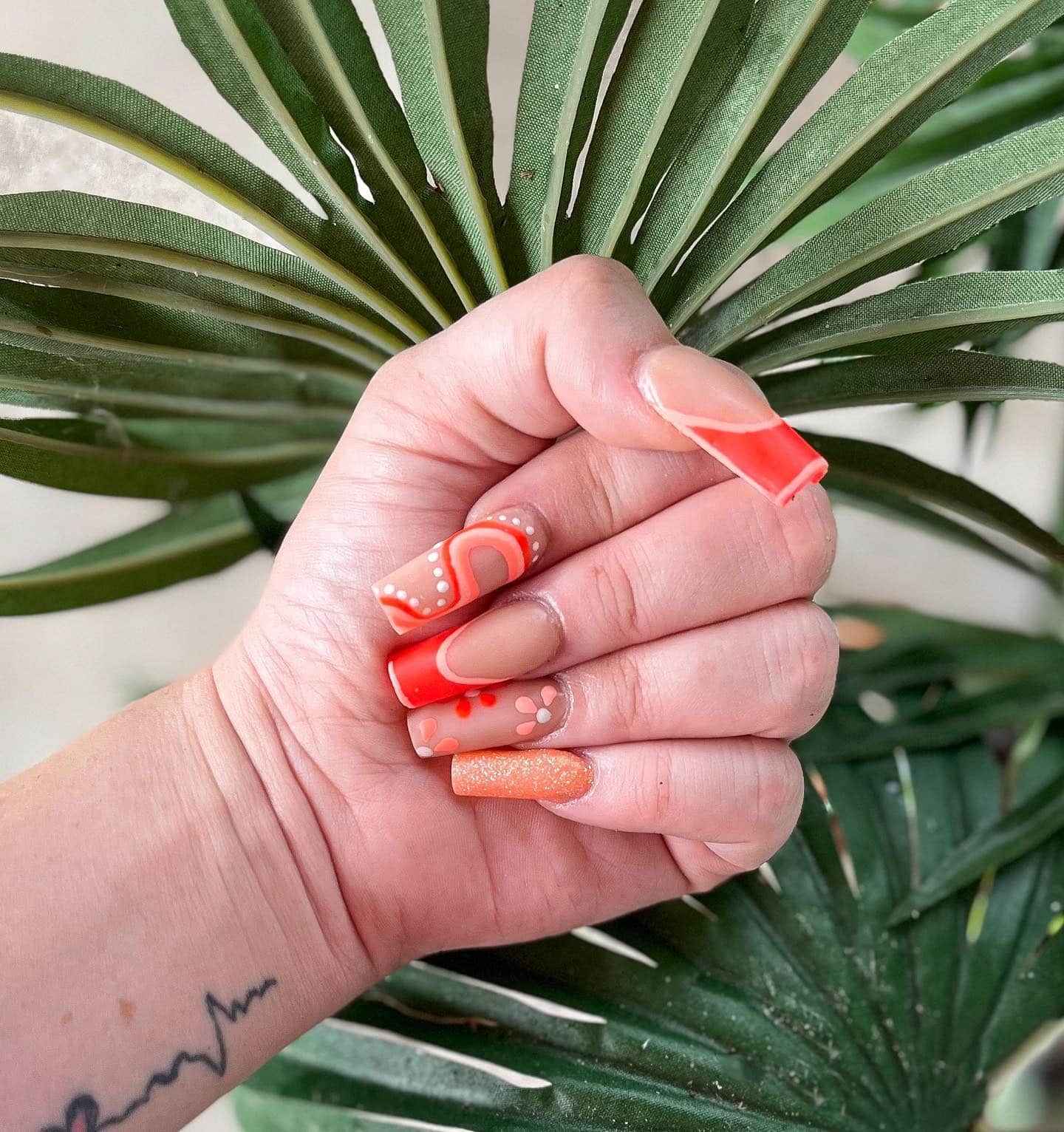 22. Tangerine Swirl Mix Nails - hippie nail ideas