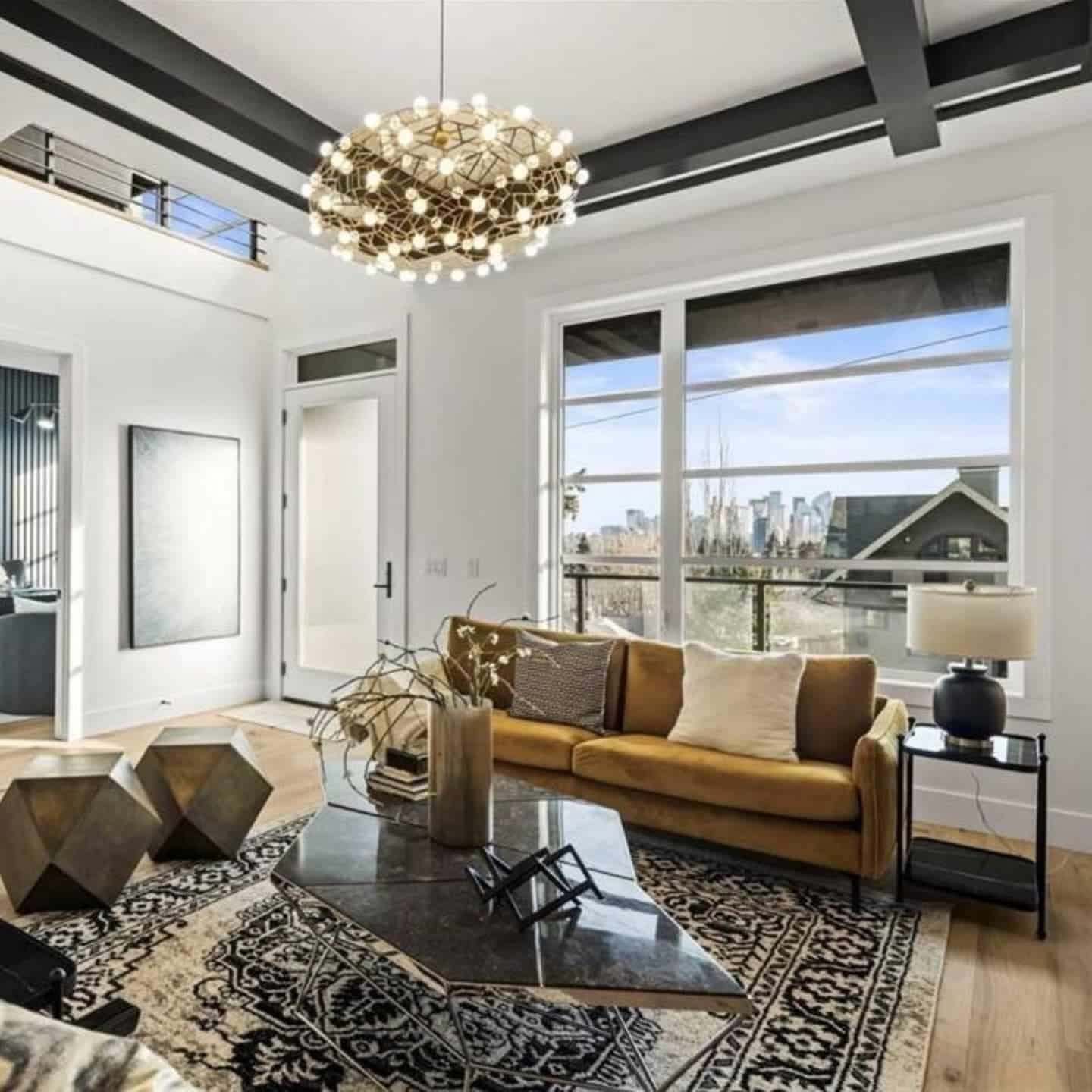 9. Modern Glam with Architectural Drama - black and cream living room ideas