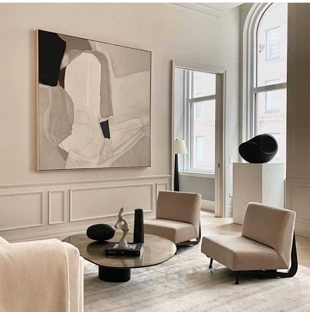 12. Architectural Artistry in Cream and Charcoal - black and cream living room ideas