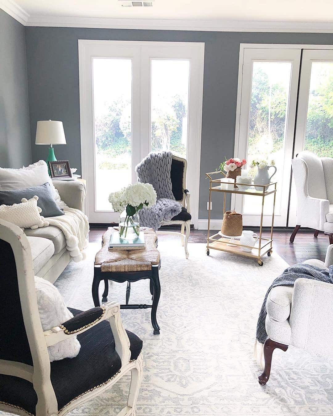 16. Elegant Comfort with Classic Black Detailing - black and cream living room ideas