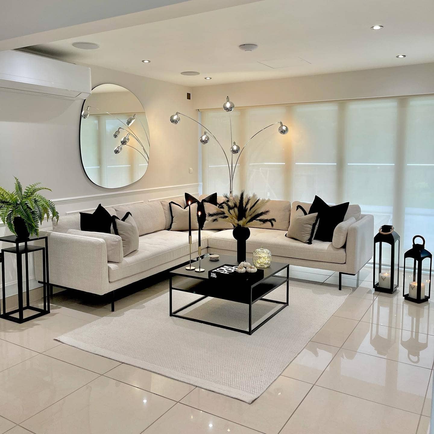 22. Contemporary Elegance with Monochrome Accents - black and cream living room ideas