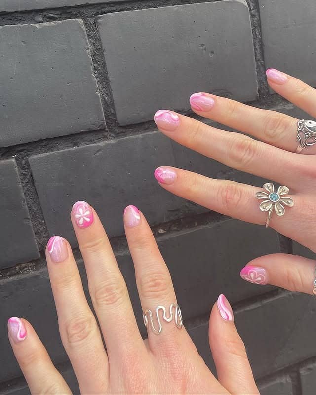 12. Pink Swirl Daisy Nails - iridescent nail ideas