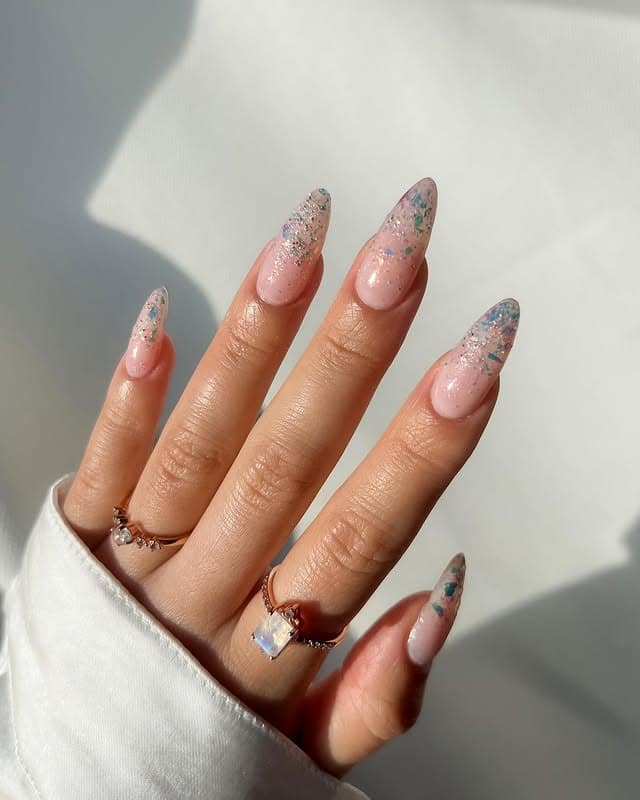 15. Smoky Chrome Stiletto Nails with Crystals - iridescent nail ideas