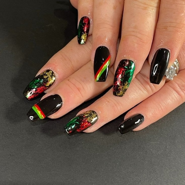 8. Rasta Foil Shine on Black Base - jamaican nail ideas