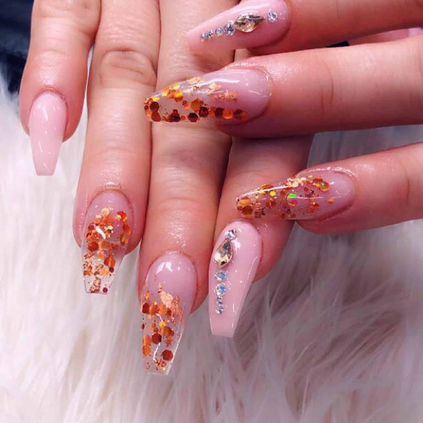 20. Amber Luxe Glitter Fade - jamaican nail ideas