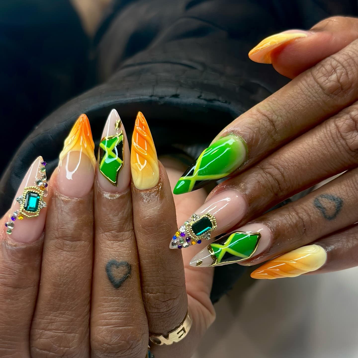 22. Regal Jamaican Fusion with Emerald Accents - jamaican nail ideas