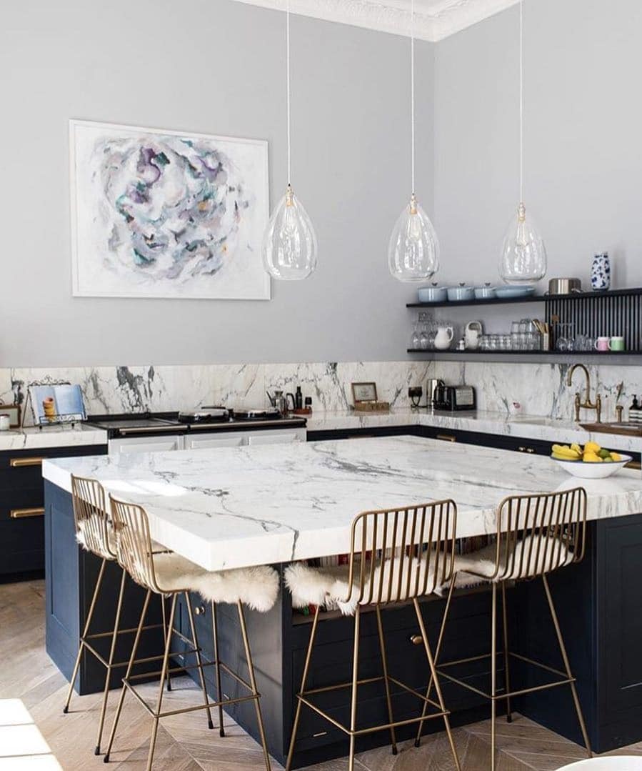 4. Marble Luxe with Navy Accents - dark blue kitchen ideas