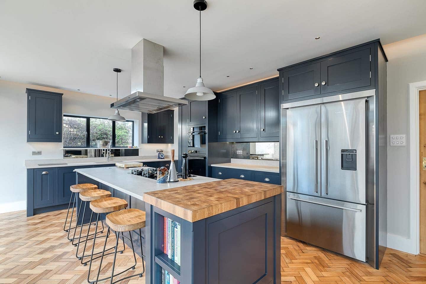 13. Contemporary Shaker Kitchen in Deep Blue and Butcher Block - dark blue kitchen ideas