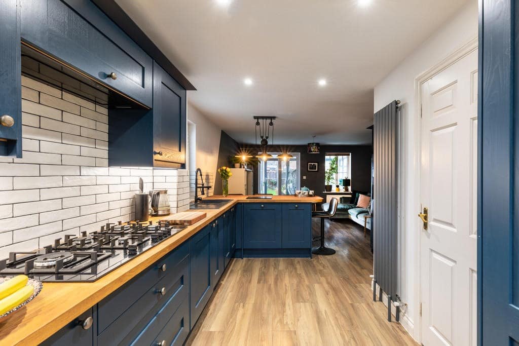 14. Modern Cottage Style in Navy and Oak - dark blue kitchen ideas