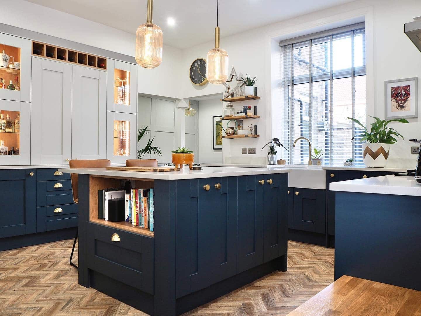 18. Warm Contemporary Kitchen with Deep Blue and Brass Details - dark blue kitchen ideas