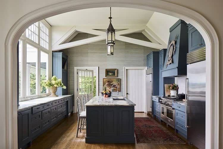 19. Traditional Elegance in Blue and Marble - dark blue kitchen ideas