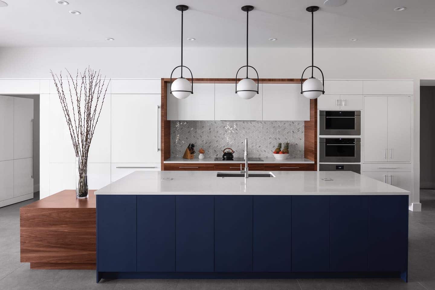 22. Modern Balance in Deep Blue, Walnut, and White - dark blue kitchen ideas