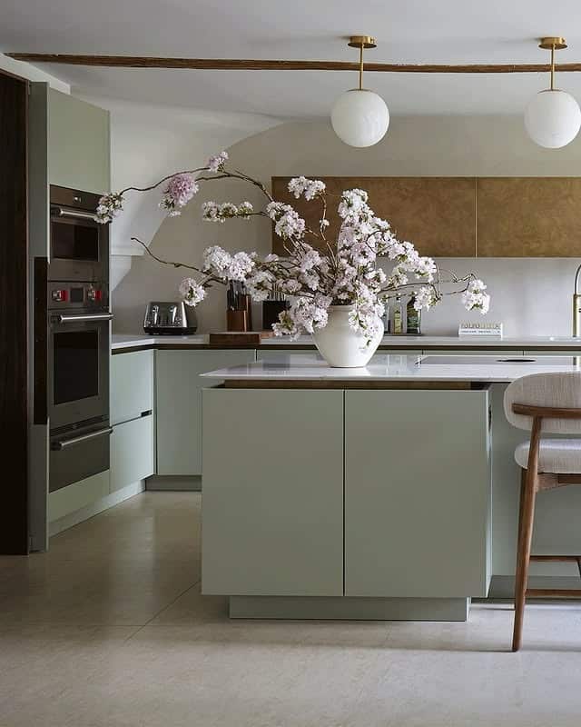 18. Soft Sage with Modern Brass Touches - contemporary kitchen ideas