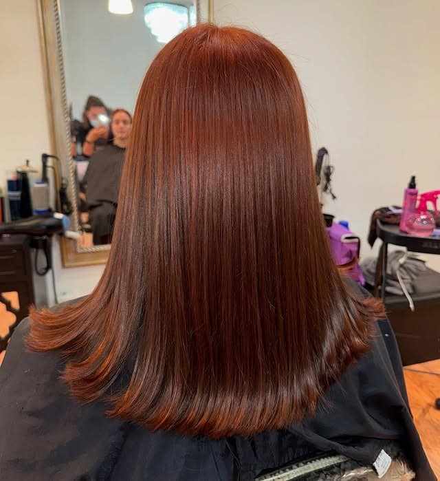 5. Sleek Cinnamon Chestnut Lob - Ginger Hair Color