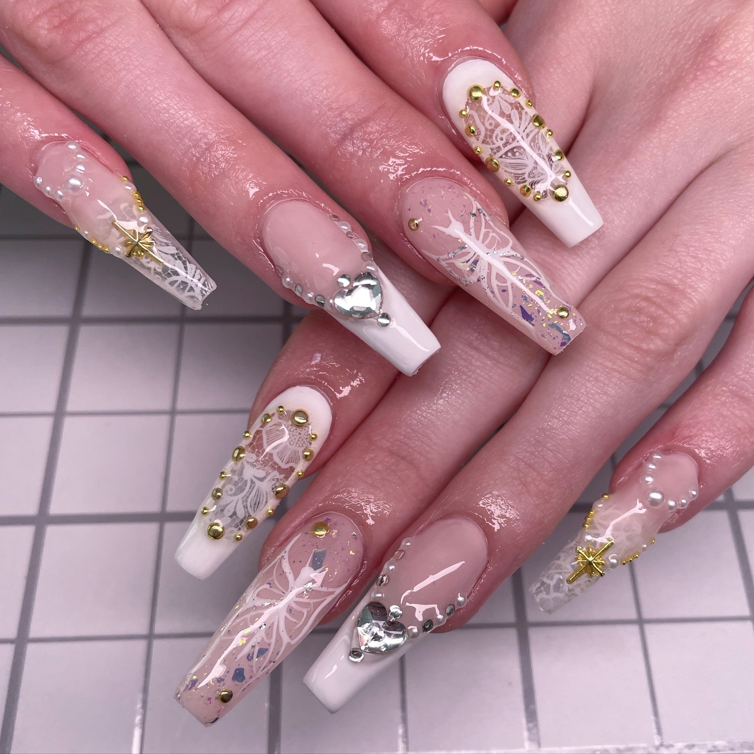 7. White Luxe with Gold and Pearl Detailing - long coffin nail ideas