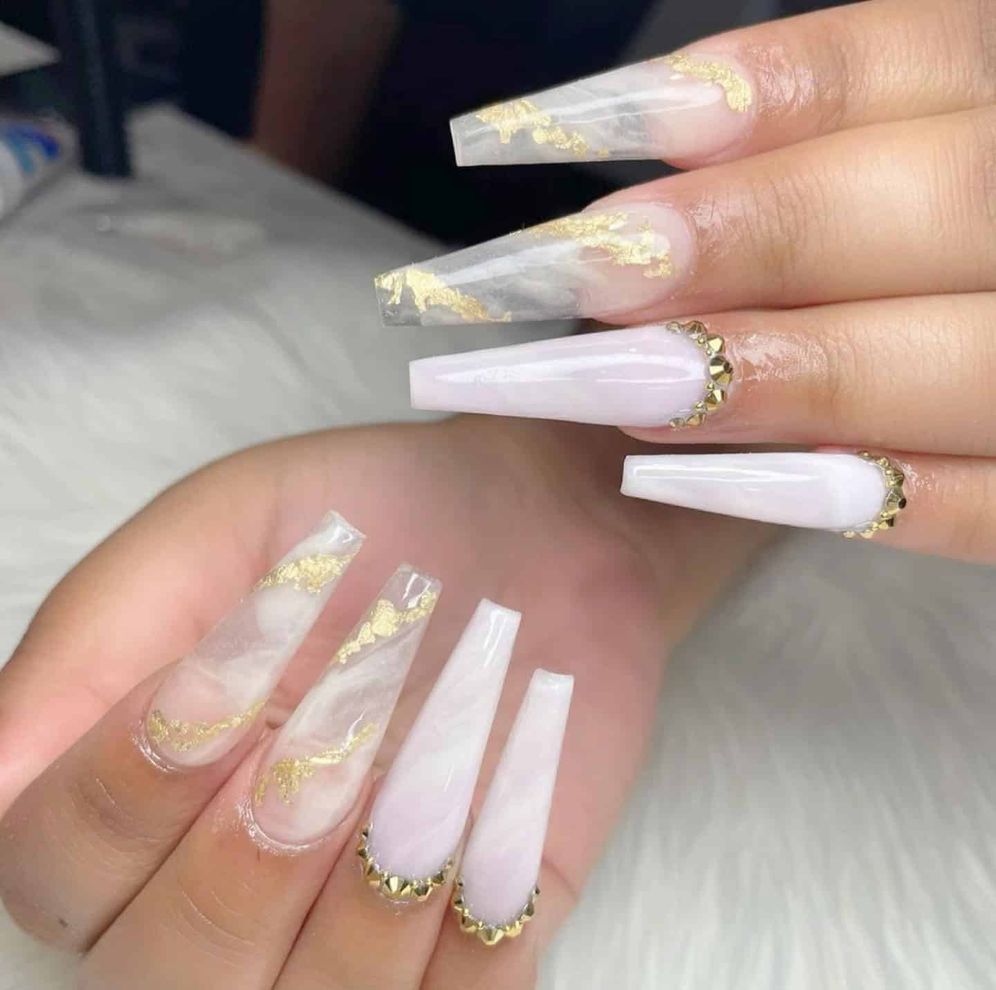 12. Milky Marble with Gold Foil Detailing - long coffin nail ideas