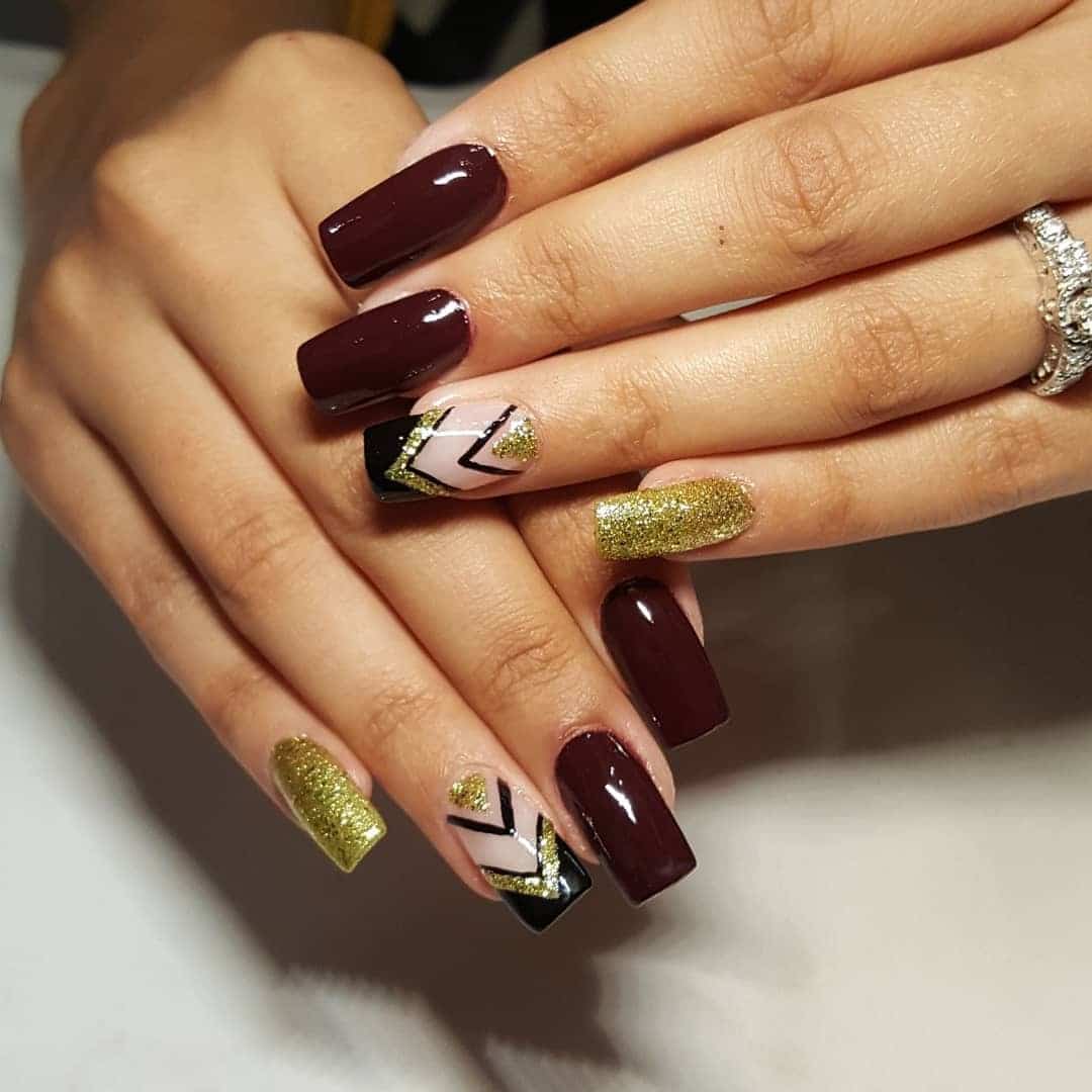 1. Golden Glam Geometry - maroon and gold nail ideas