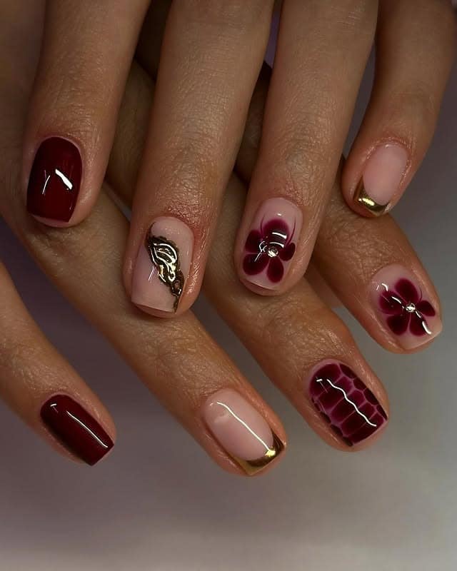 3. Crimson Bloom Elegance - maroon and gold nail ideas