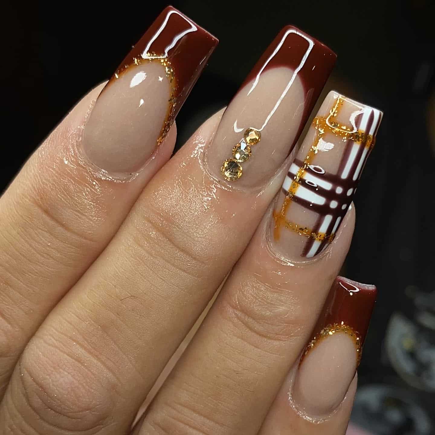 5. Plaid Perfection in Gold and Wine - maroon and gold nail ideas