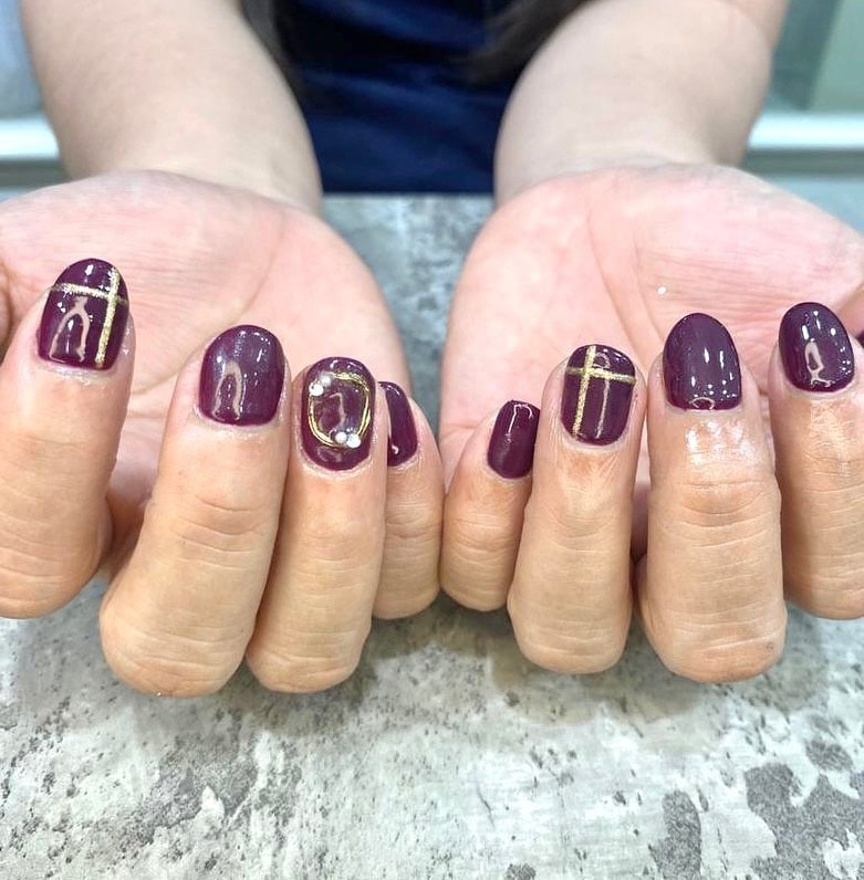 6. Regal Plum Geometry - maroon and gold nail ideas