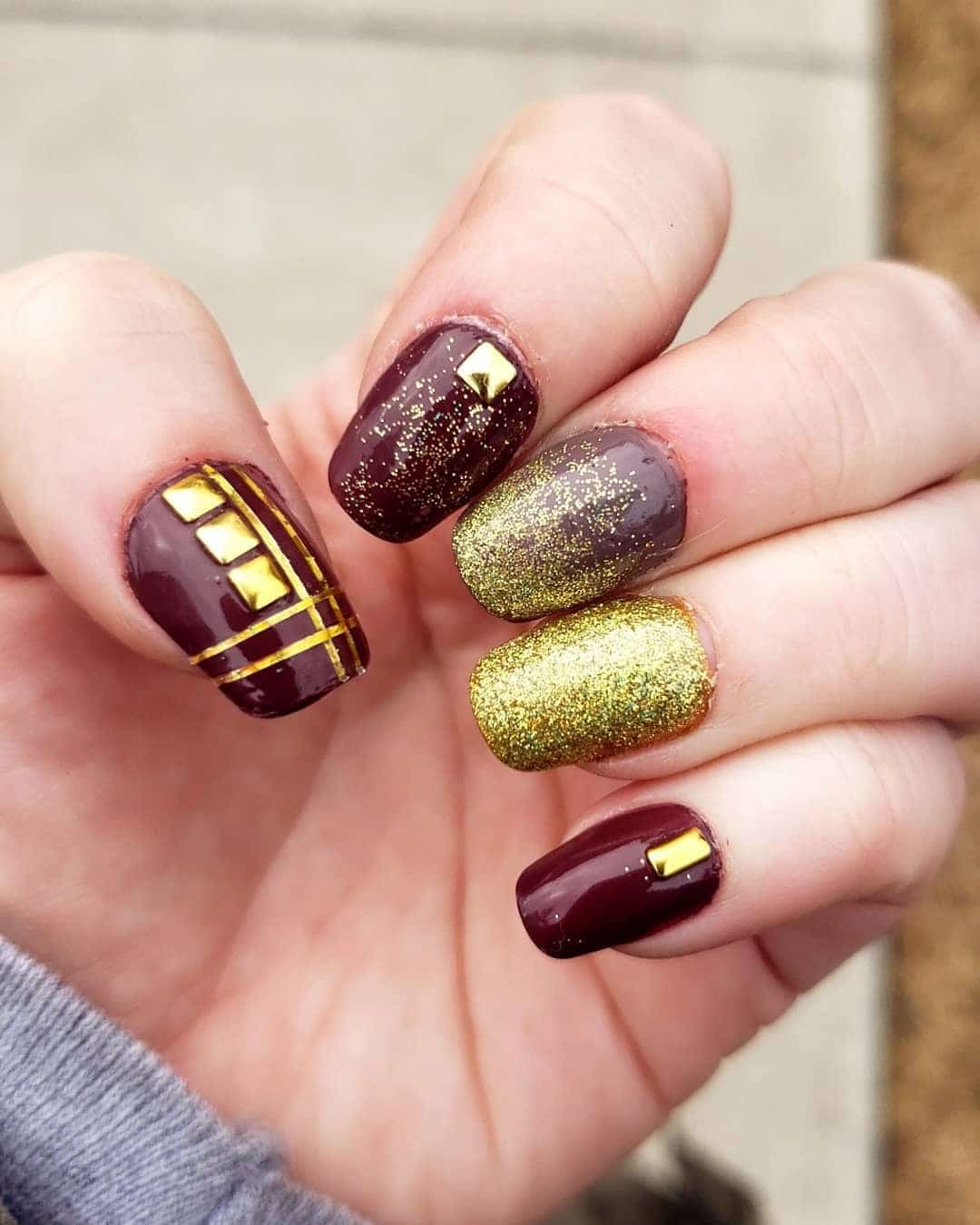 8. Golden Edge Chic - maroon and gold nail ideas