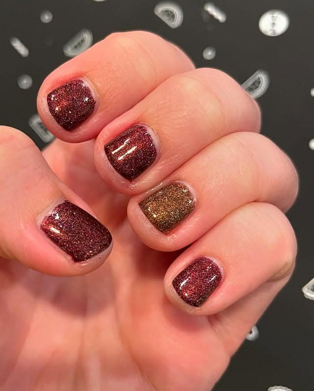 10. Glitter Fusion Elegance - maroon and gold nail ideas