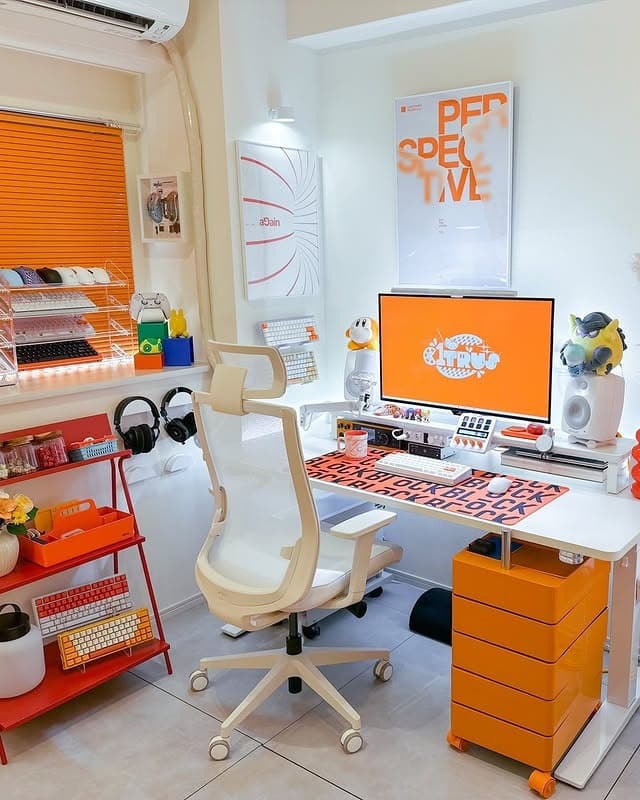 7. Creative Tech Corner with Orange Highlights - orange office ideas