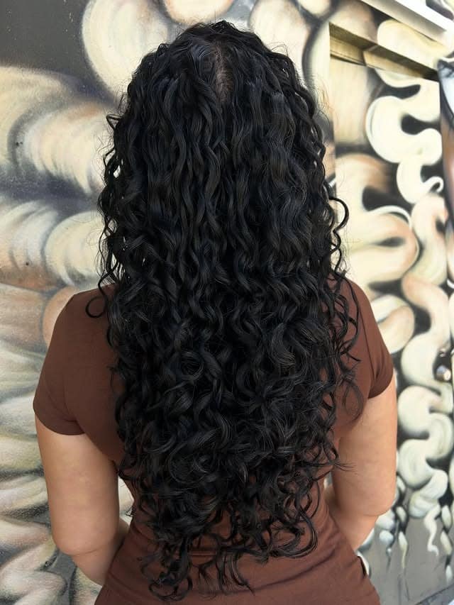 2. Deep Ebony Spiral Cascade - Curly Hairstyles